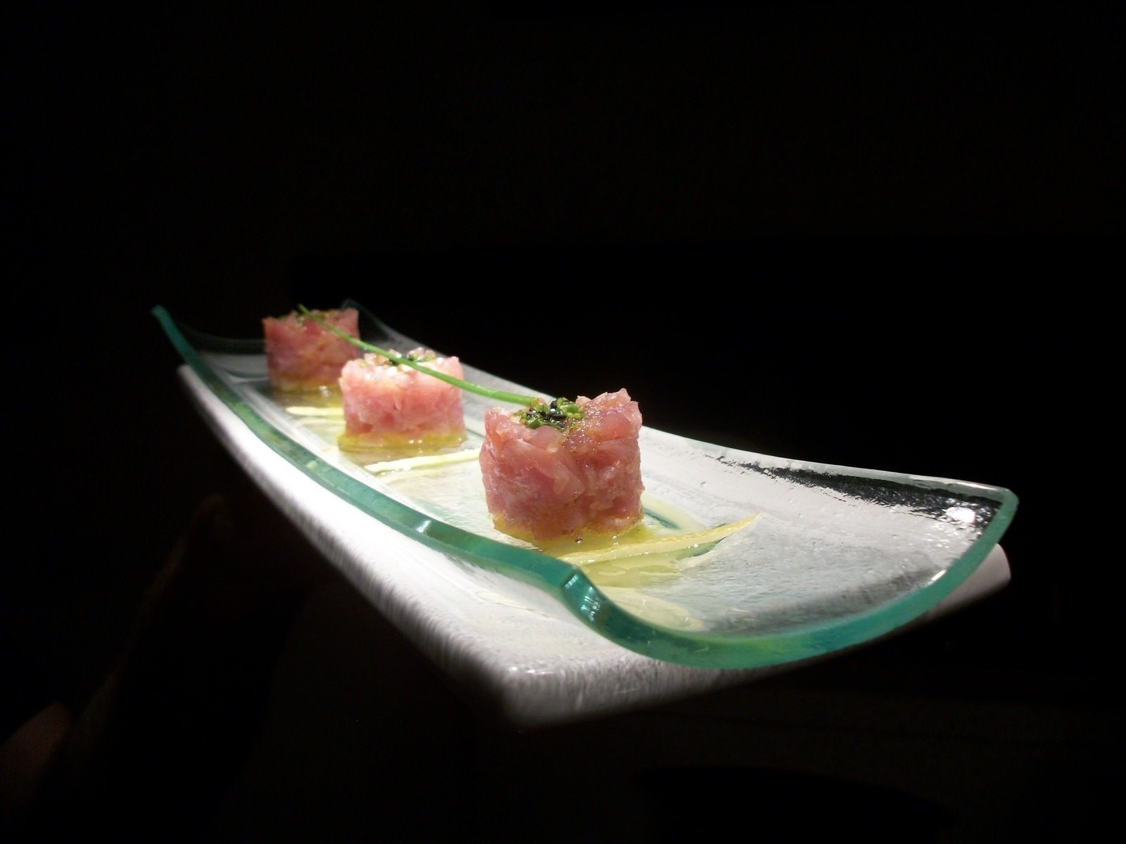 close up of three individual bites of "tuna" on a glass serving dish by Tarik Abdullah - Jordan Winery food photo contest 4th place winner
