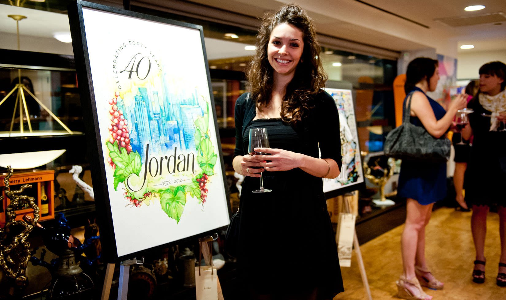 Stephanie Mead posing next to her art piece "Celebrate!" which won grand prize at the 4 on 4 New York