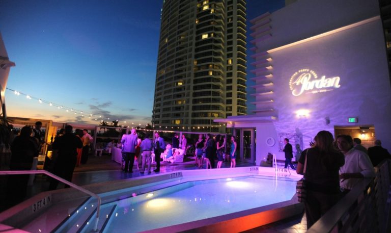 Jordan Winery 40th anniversary celebration logo being projected on the side of the building at Soho Beach House cocktail party