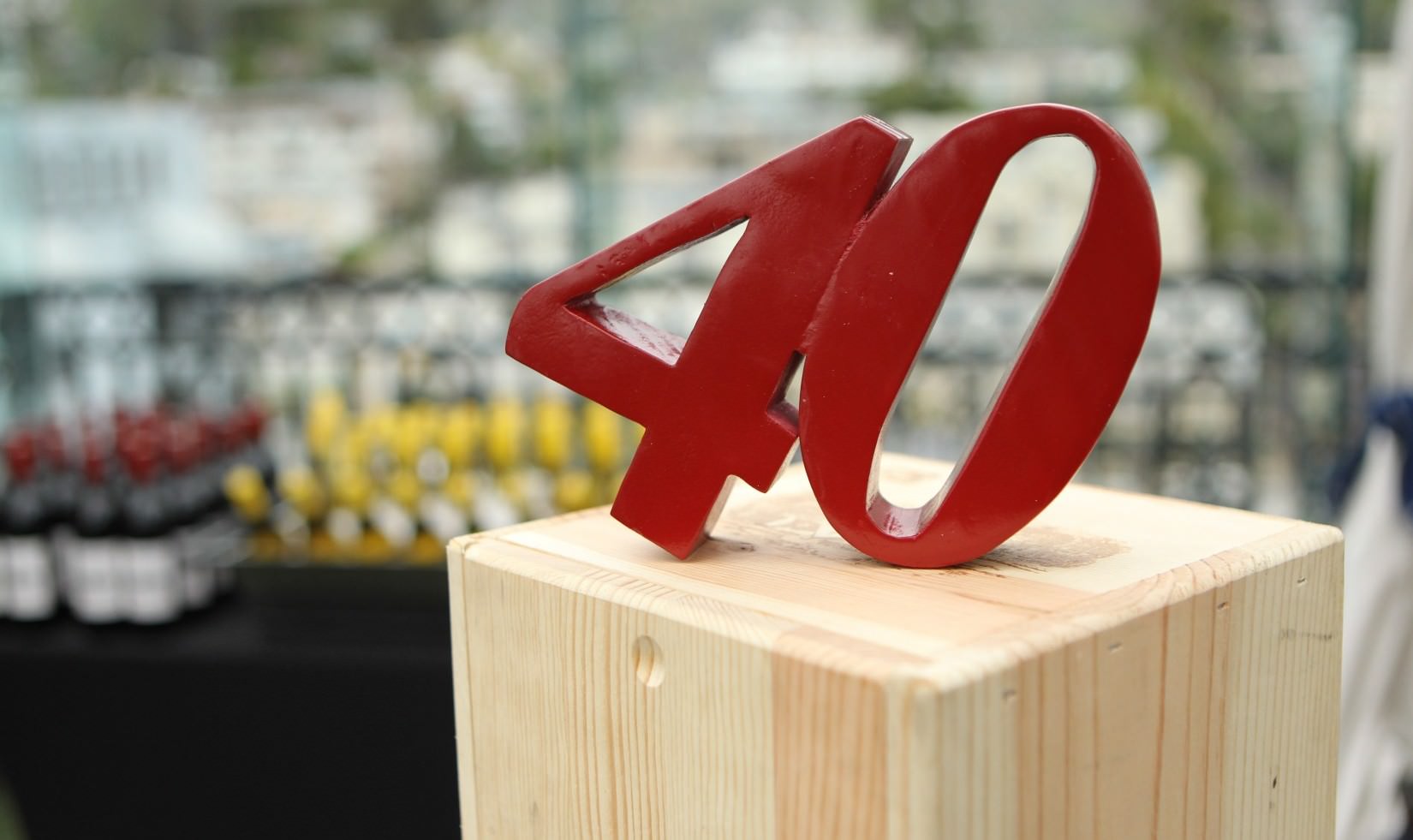 the number "40" in blocks with bottles of Jordan Winery Cabernet and Chardonnay in the background