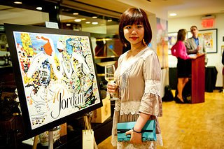 Stella Chang posing next to her entry piece "Cheers!" which was awarded the peoples choice awards at 4 on 4 New York