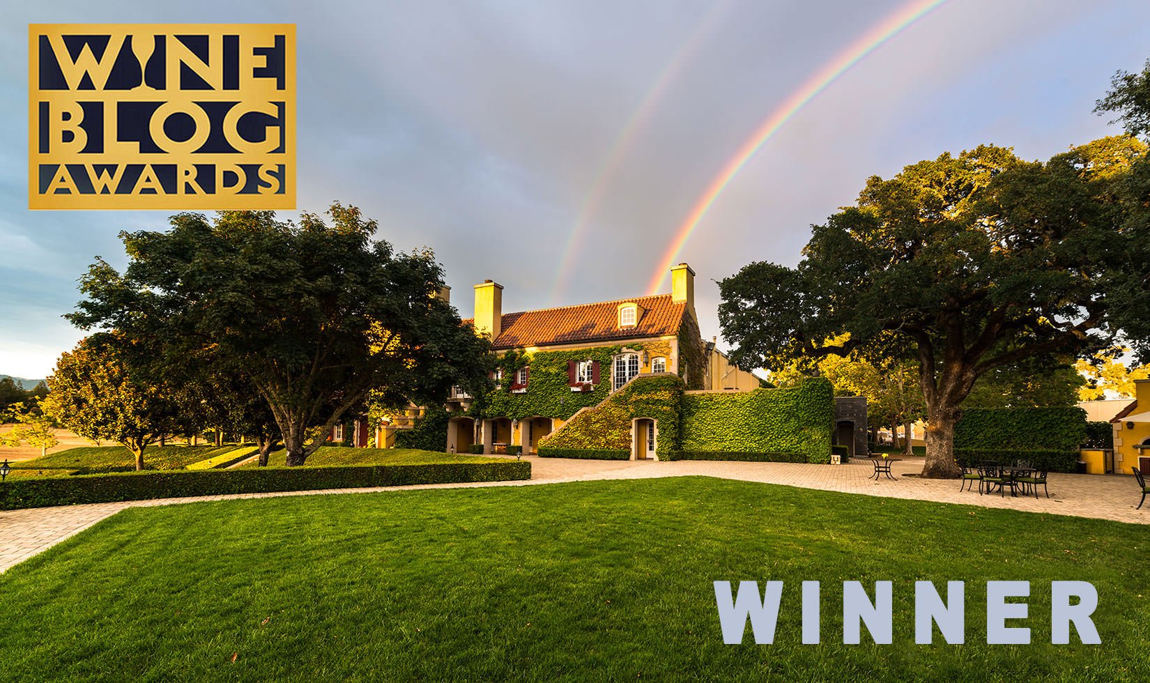 Jordan Winery Chateau with rainbow in background with Wine Blog Awards logo and image text: "Winner"