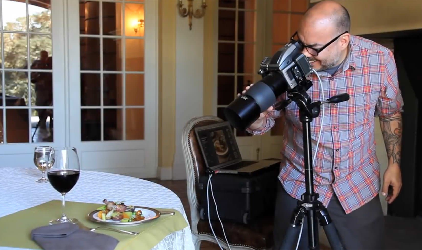 Photo of Matt Armendariz taking a photo of food