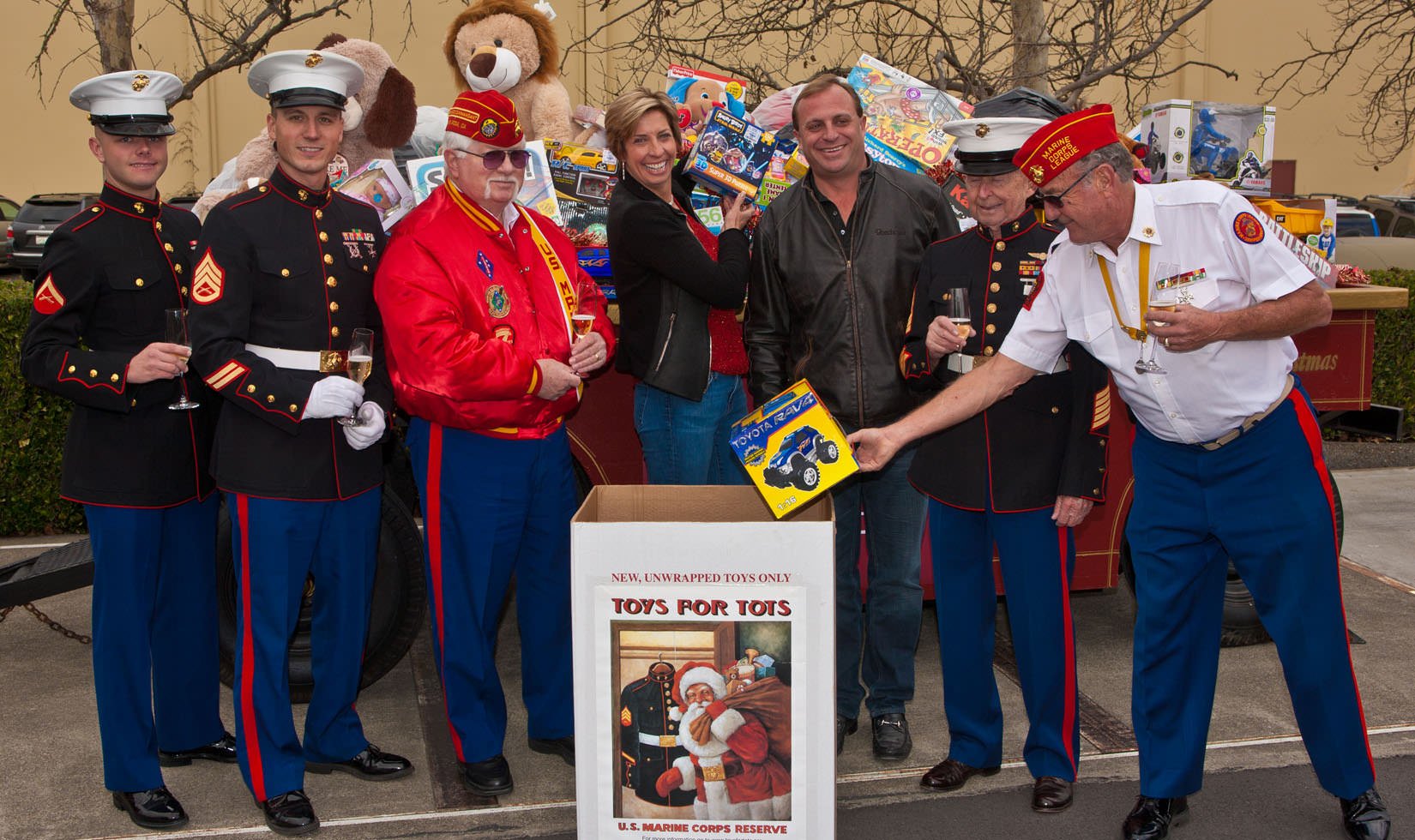 John Jordan, CEO and proprietor of Jordan Winery posing with Judy Jordan and members of the US Marine Reservists gathered at Jordan Winery for a toy drive