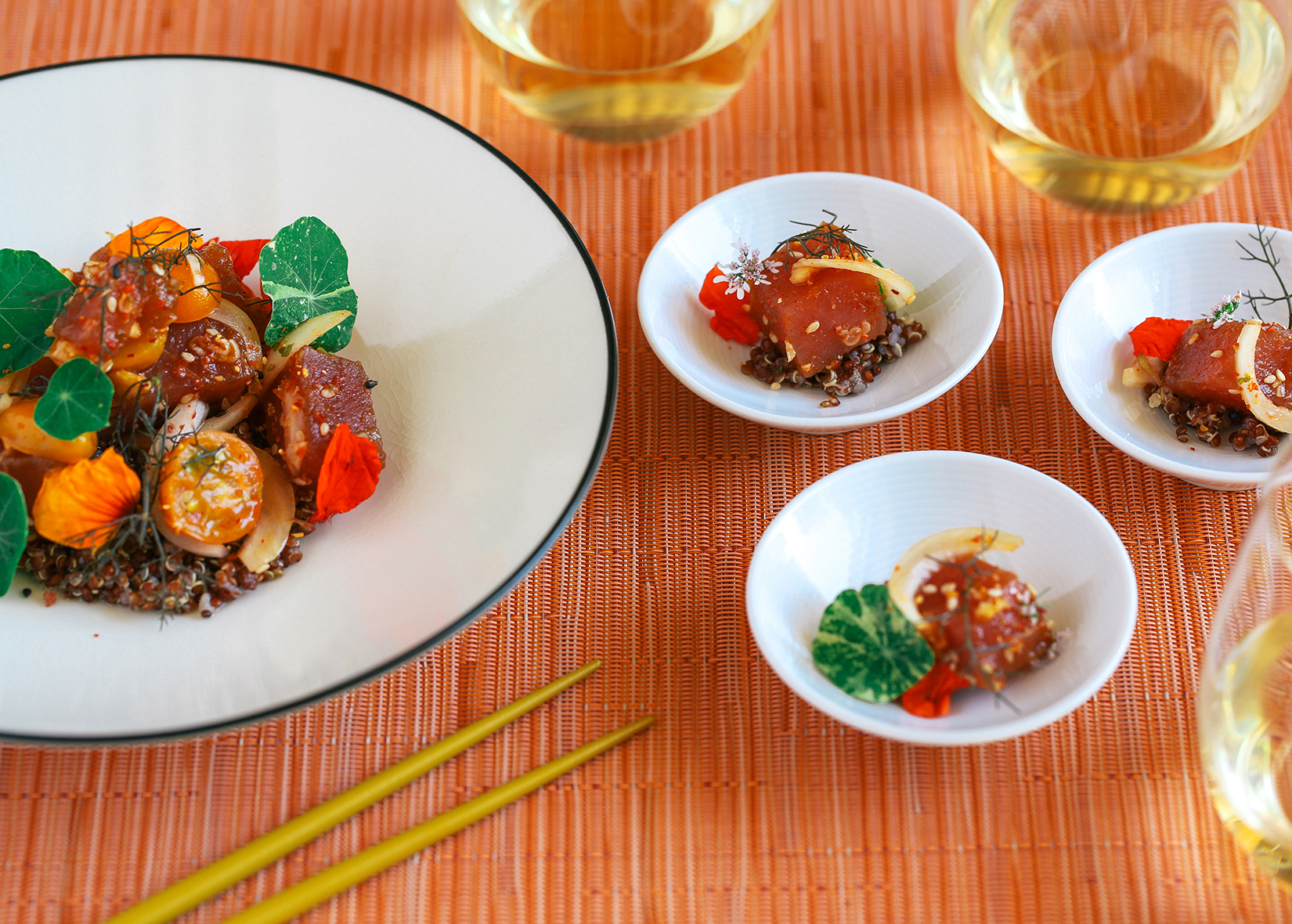 Ahi Tuna Poke with quinoa and heirloom tomatoes on table setting