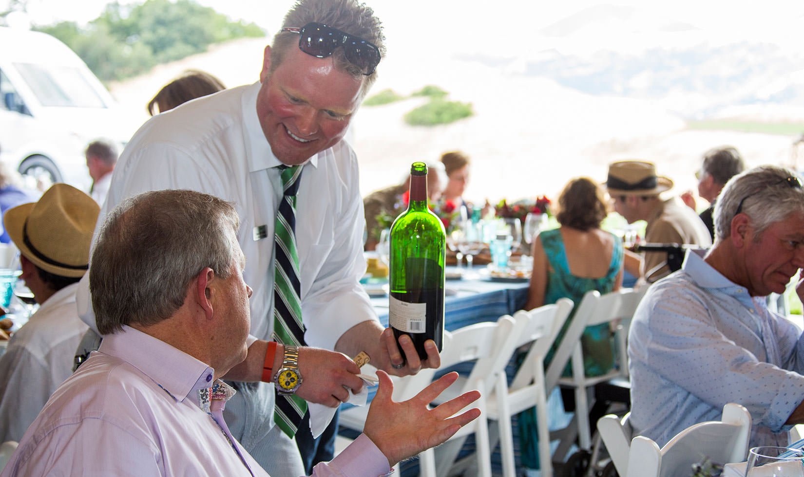Guest being served a magnum of Jordan Winery Cabernet at a Summer Appreciation event, 2015