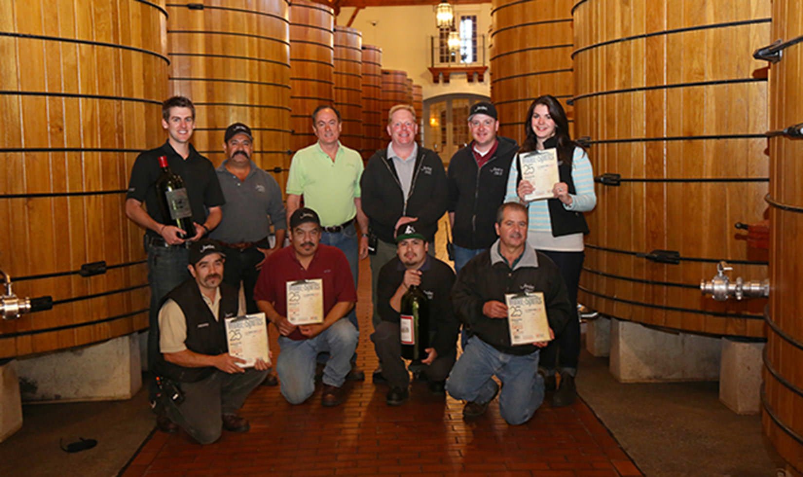 Jordan Winery 2014 winemaking crew posing in the large oak tank room at Jordan Winery