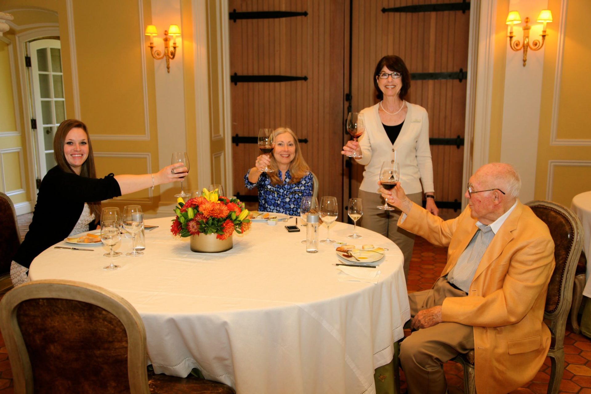 Mr. James Woods, Jordan Winery staff member, Mr. Woods' caregiver and his daughter Bobbie in the Jordan Winery dining room at a private tasting organized by "Wish of a Lifetime" for Mr. James Woods