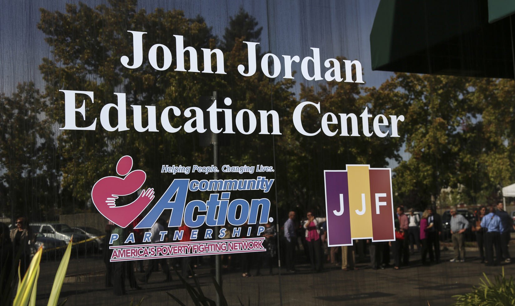 John Jordan Education Center, John Jordan Foundation, and Community Action Partnership decals on a window