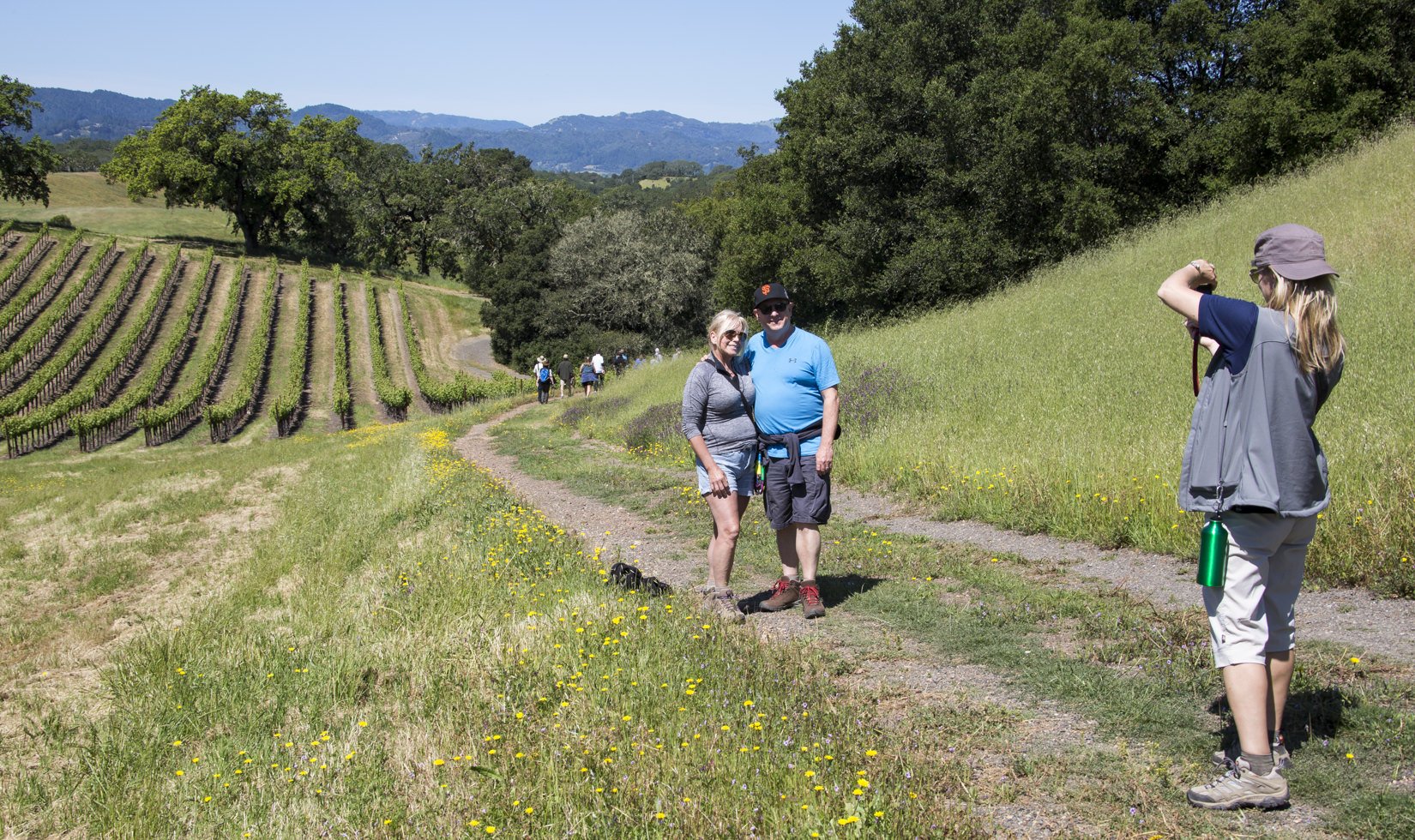 Guests posing for a photo during a Spring Vineyard Hike at Jordan Winery.
