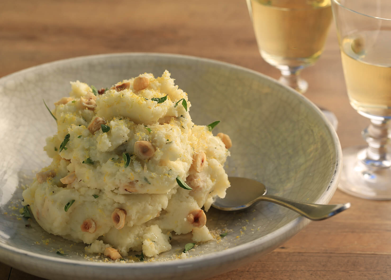 Meyer lemon and hazelnut mashed potatoes plated at table