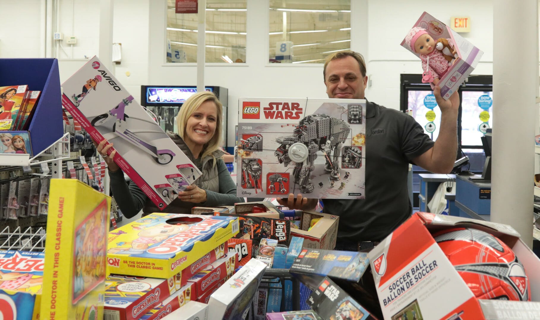 Lisa Mattson, Director of Marketing at Jordan Winery, and John Jordan, CEO and proprietor shopping for toys to donate to the Toys for Tots drive