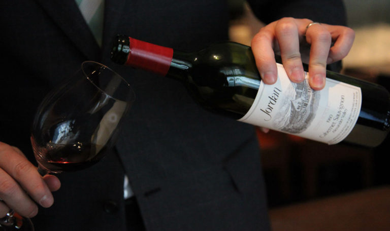 hands Pouring 1980 Jordan Alexander Valley Cabernet Sauvignon into a glass