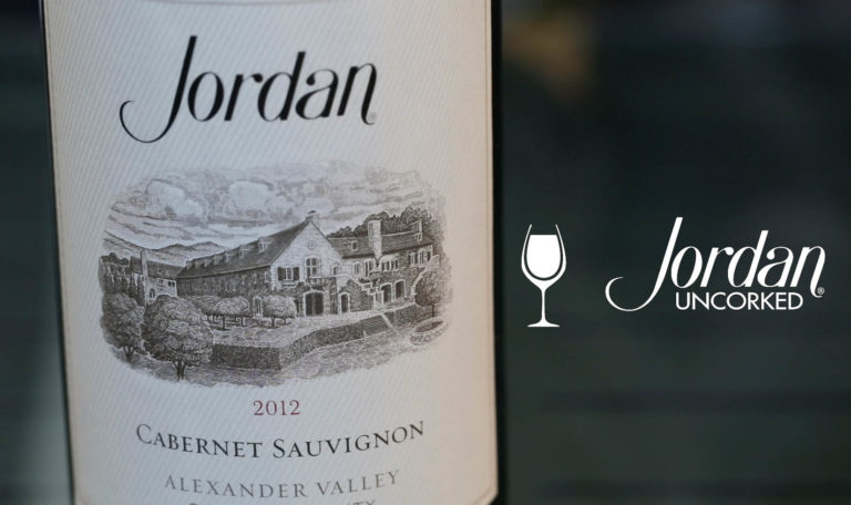 still from a video made by Jordan Winery featuring a close up of a magnum of 2012 Jordan Winery Cabernet with image text: "Jordan Uncorked"