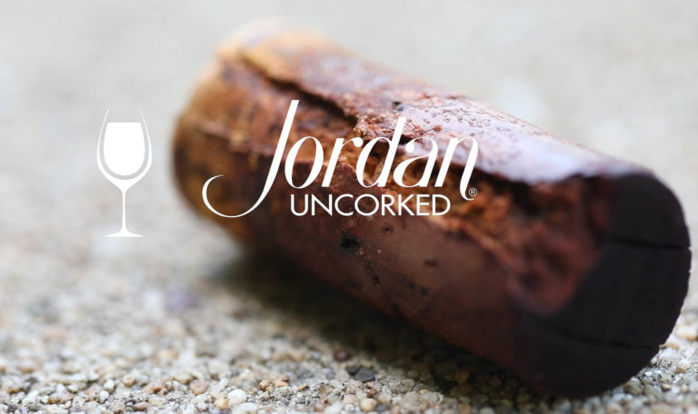 still from a video made by Jordan Winery featuring a close up of an old, wine soaked cork with image text: "Jordan Uncorked"