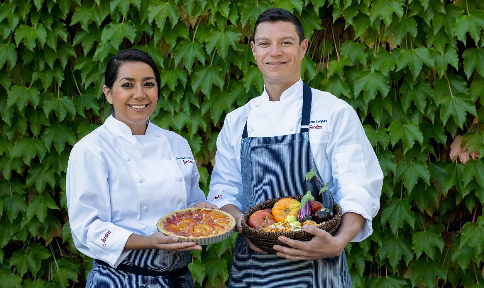 New cooks, Andrew Cooper and Griselda Lopez, pose outside of Jordan Winery's chateau