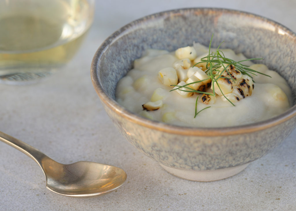 Creamy corn pudding at table setting