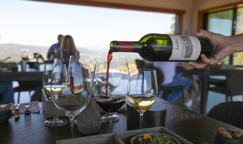 Jordan Cabernet Sauvignon poured into wine glass on a table