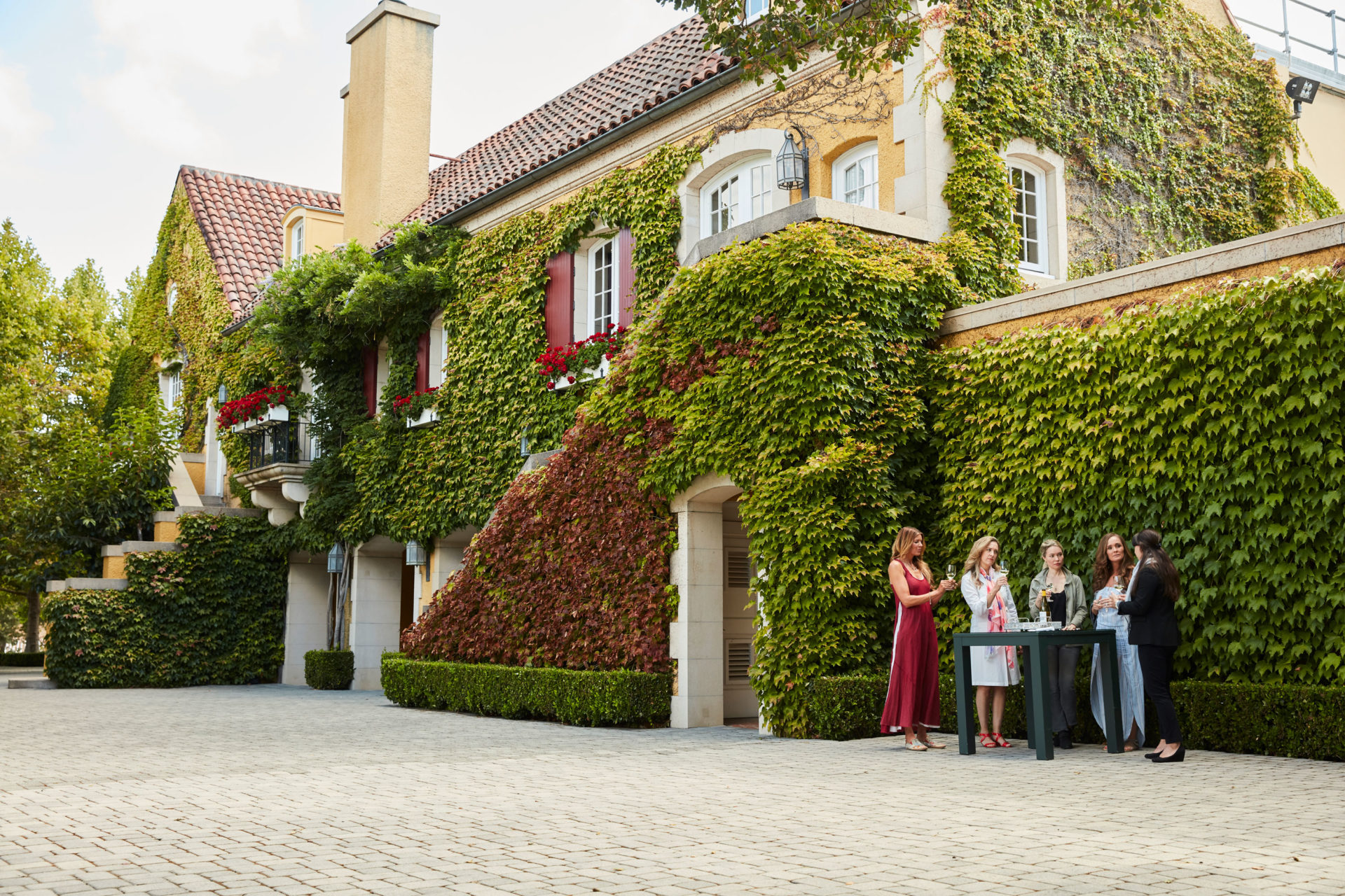 People tasting wine in front of Jordan Winery Chateau