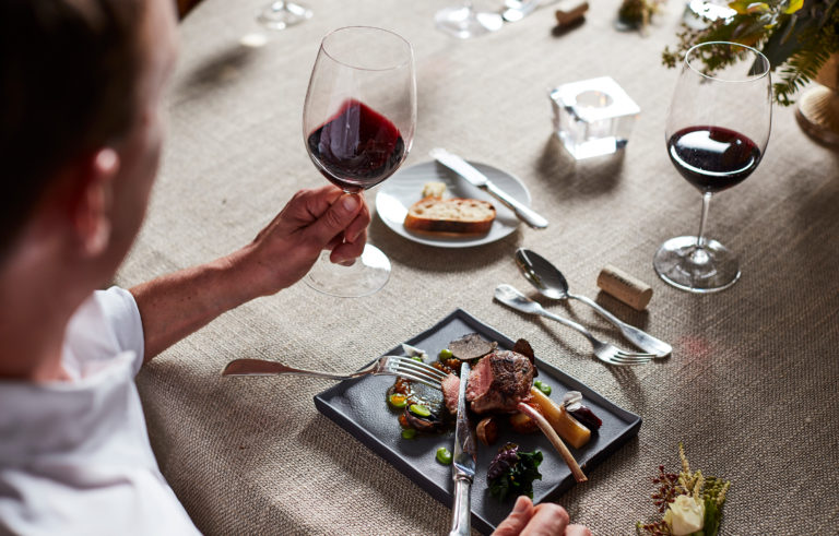 Person enjoying a meal and Jordan Cabernet Sauvignon