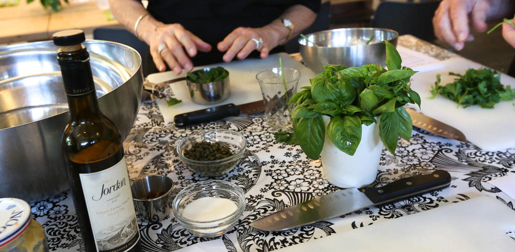 wine and herbs on kitchen countertop