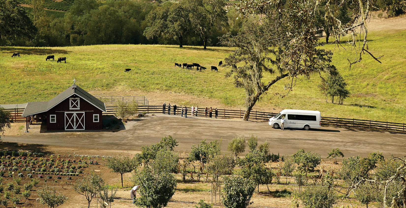 Landscape with barn, field, Jordan van and people