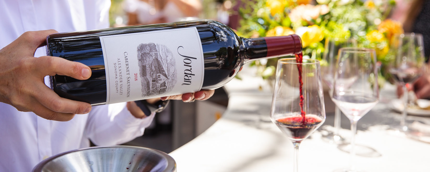 magnum of cabernet sauvignon pouring into a wine glass