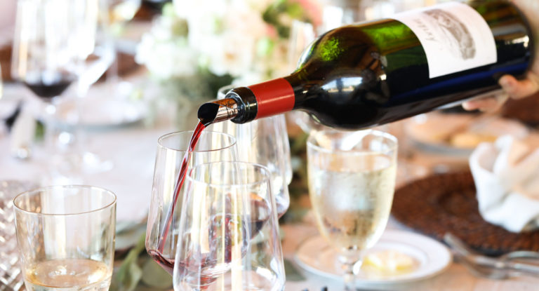 Jordan wine pouring into glass at table set