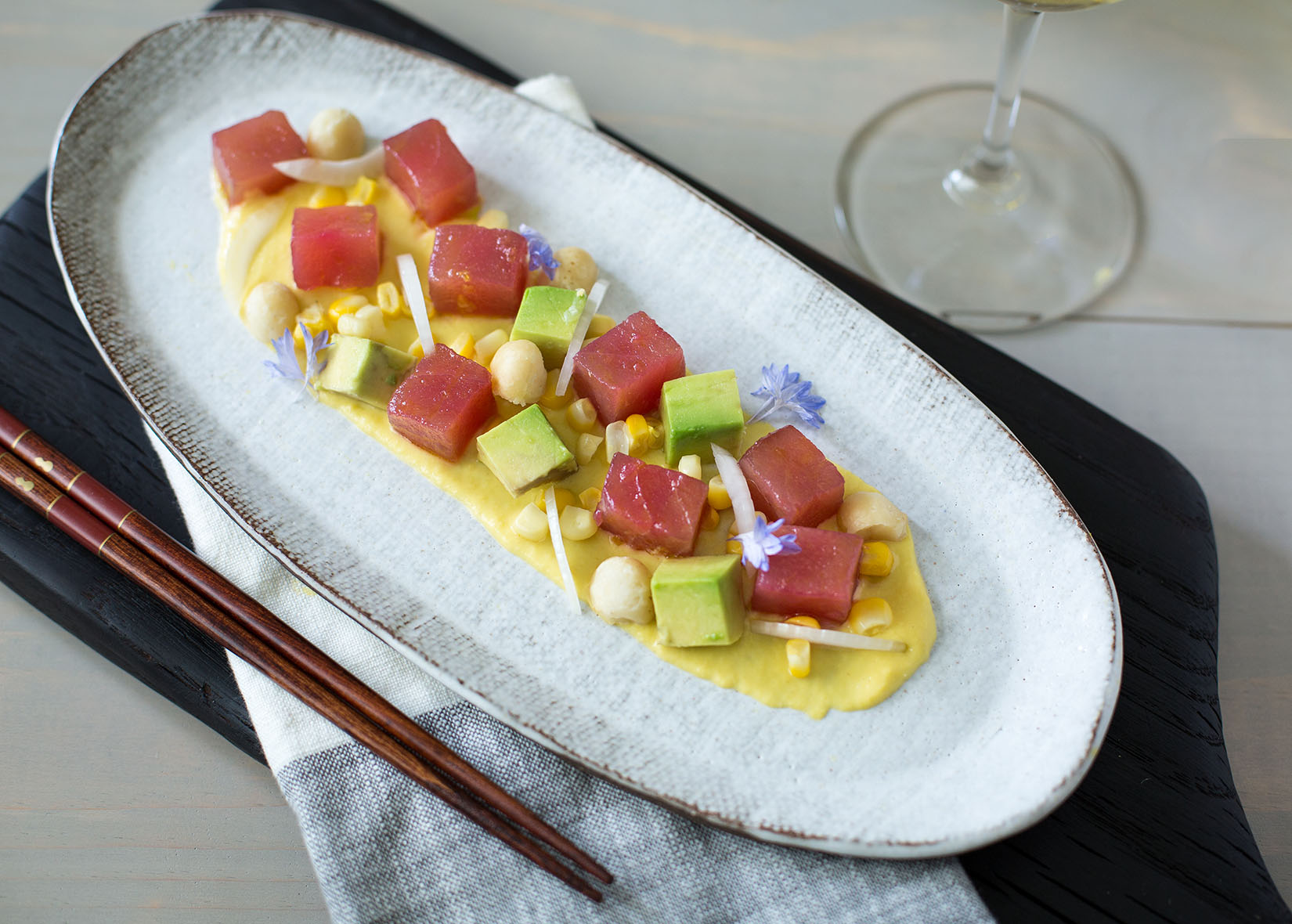 Hawaiian Ahi Poke dish on table with chopsticks