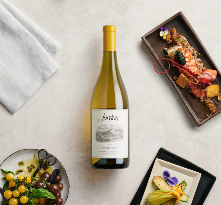 Jordan Chardonnay on tabletop with food