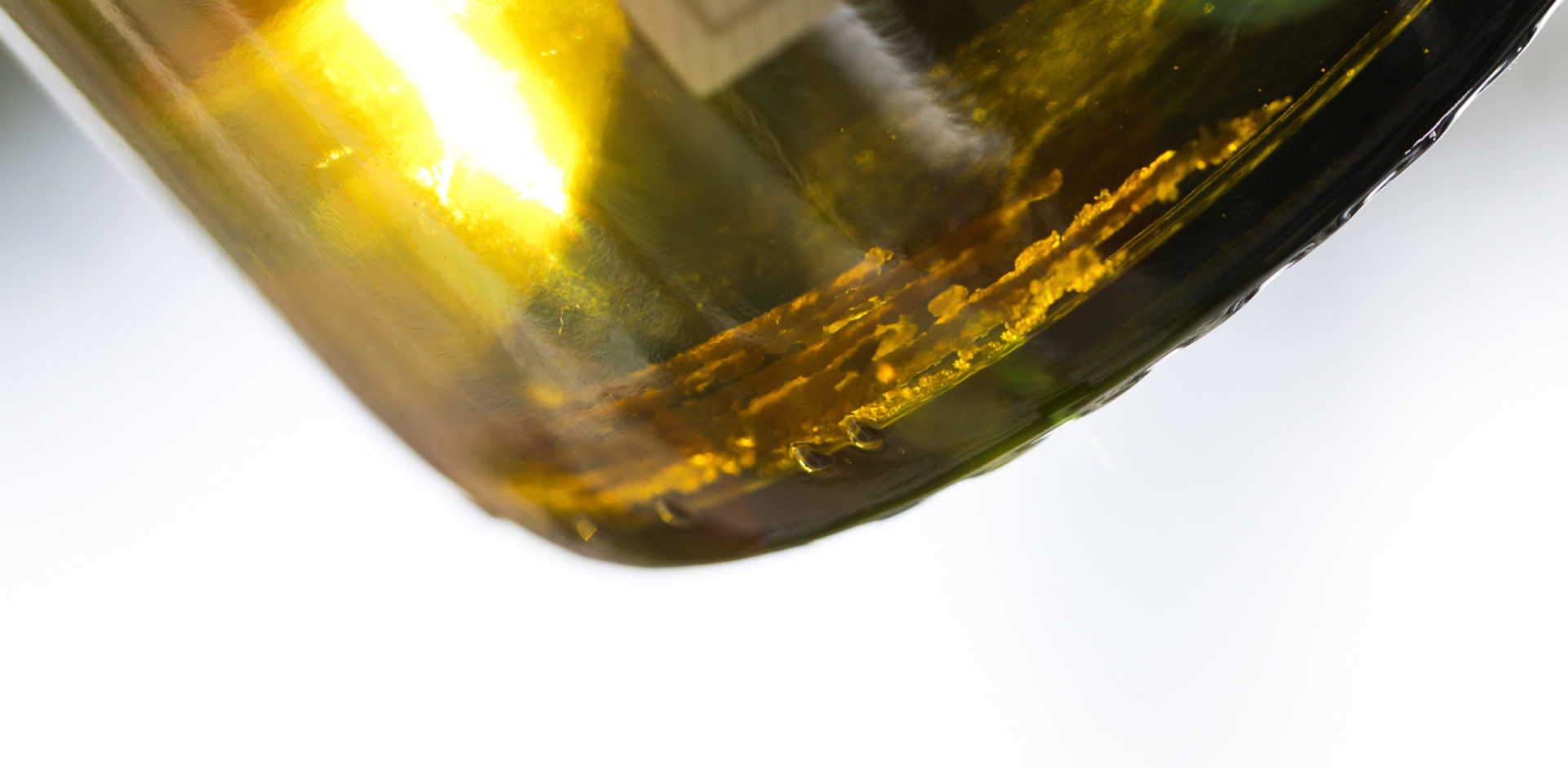 chardonnay bottle with tartrates at the bottom of bottle