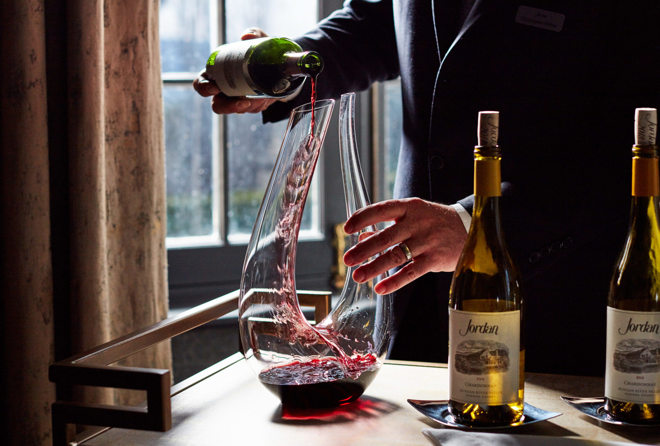 Person decanting Jordan Cabernet Sauvignon