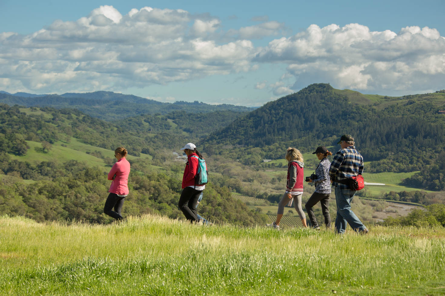 five hikers on Jordan Estate with mountains in background