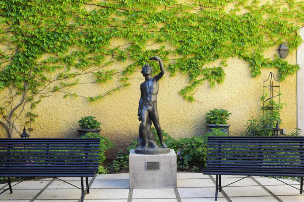 Jordan Winery Bacchus Statue in Courtyard with Green Ivy Wall