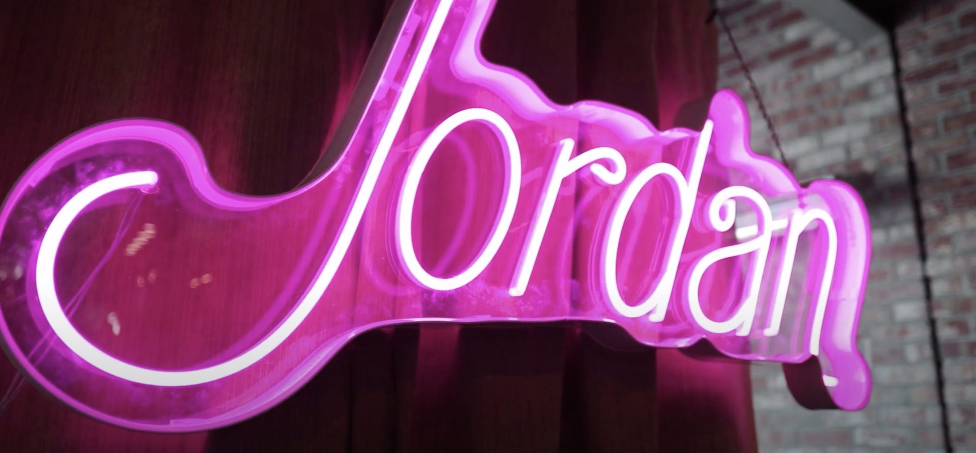 pink neon sign spelling jordan