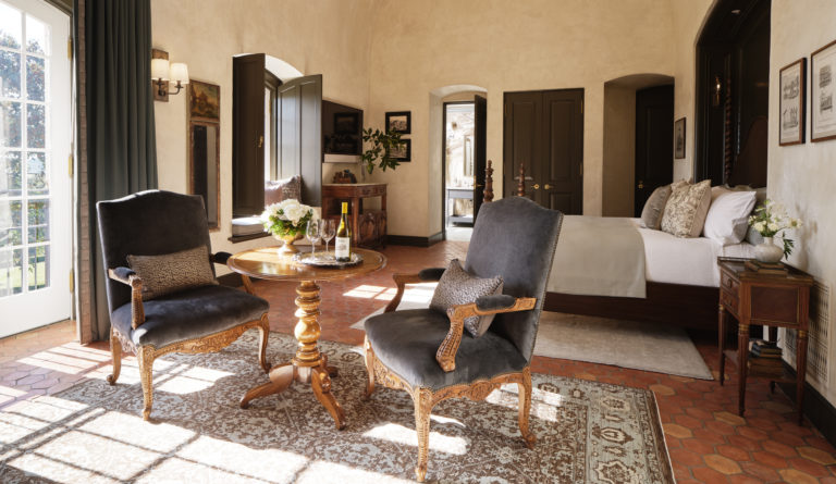 Chateau Guest Suite bedroom with hanging chandelier