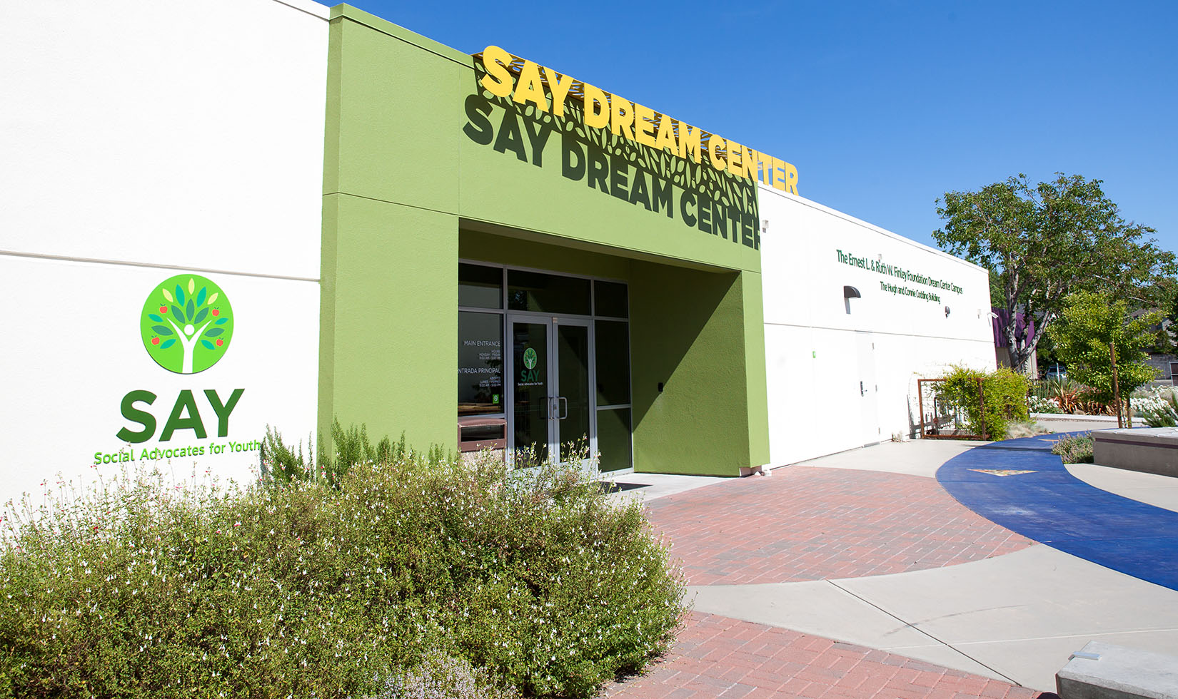 SAY Dream Center green and white building
