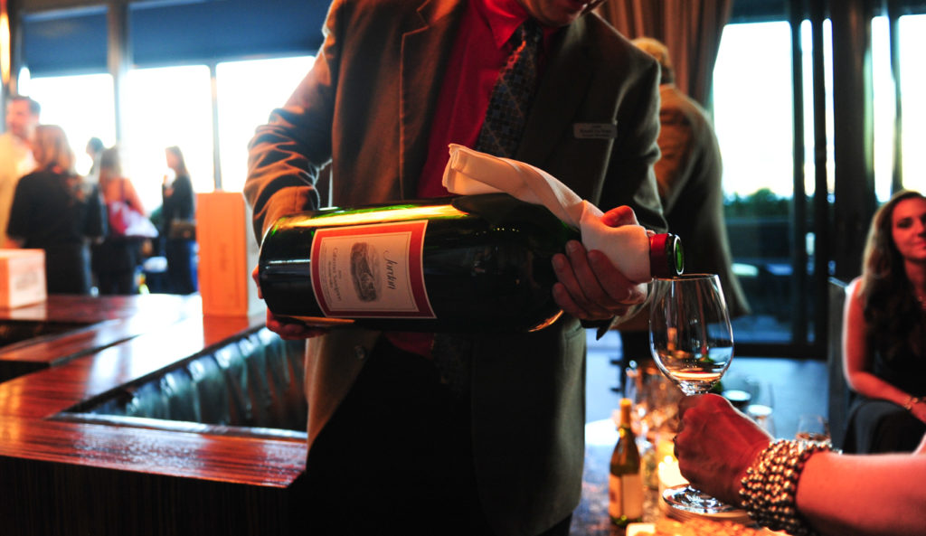 server pouring out of big bottle