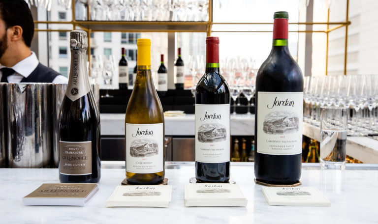 four bottles of wine on elegant white bar