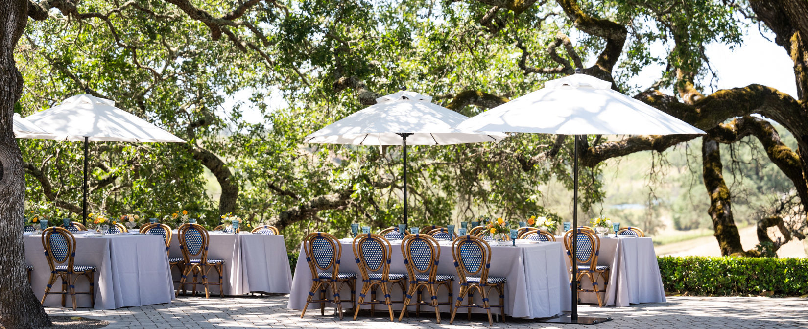 outdoor tables chairs and umbrellas on terrace