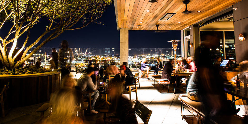 full restaurant at night with people sitting at tables