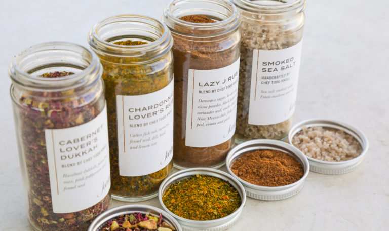 four spice blend jars in a row