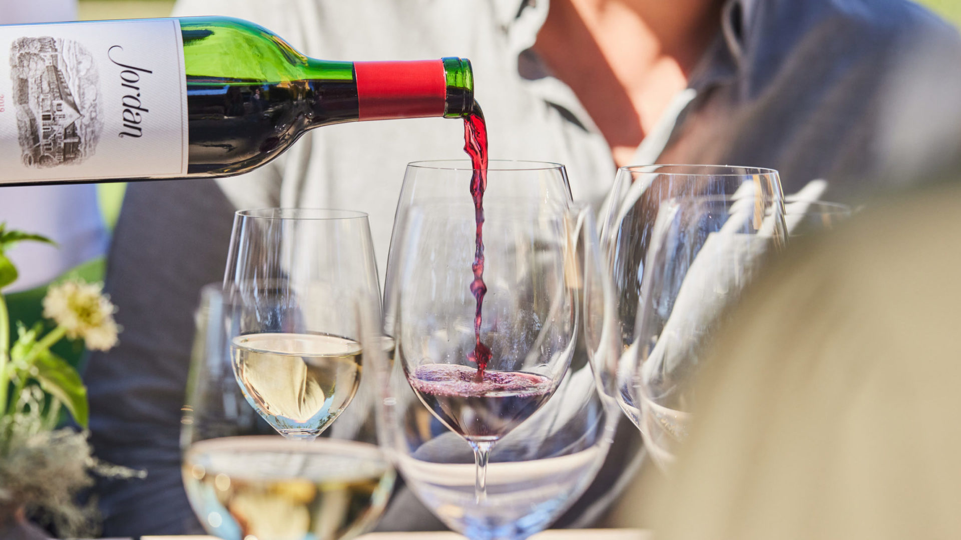 server pouring Jordan Cabernet Sauvignon into a wine glass