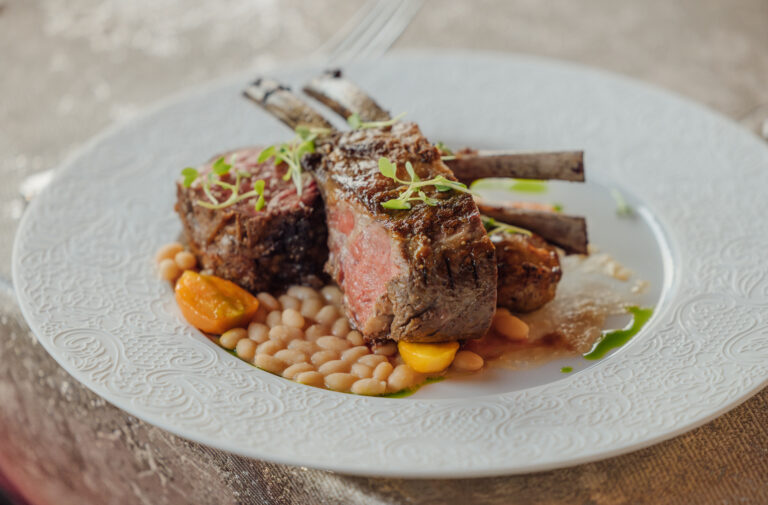 close up of lamb chops on elegant dinner table