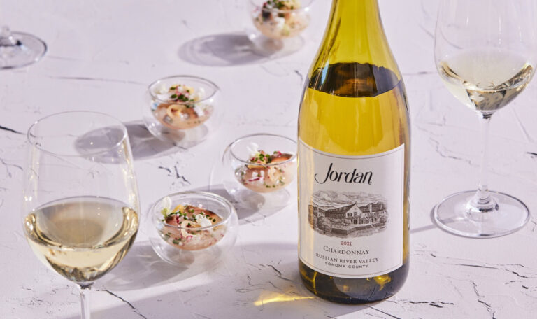 2021 Jordan Chardonnay on marble tabletop with Shima-Aji crudo pairing in glass dish