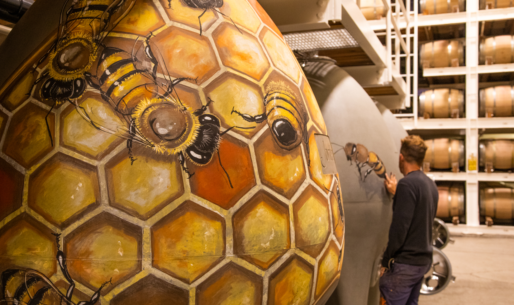 honey bee art mural in winery barrel room