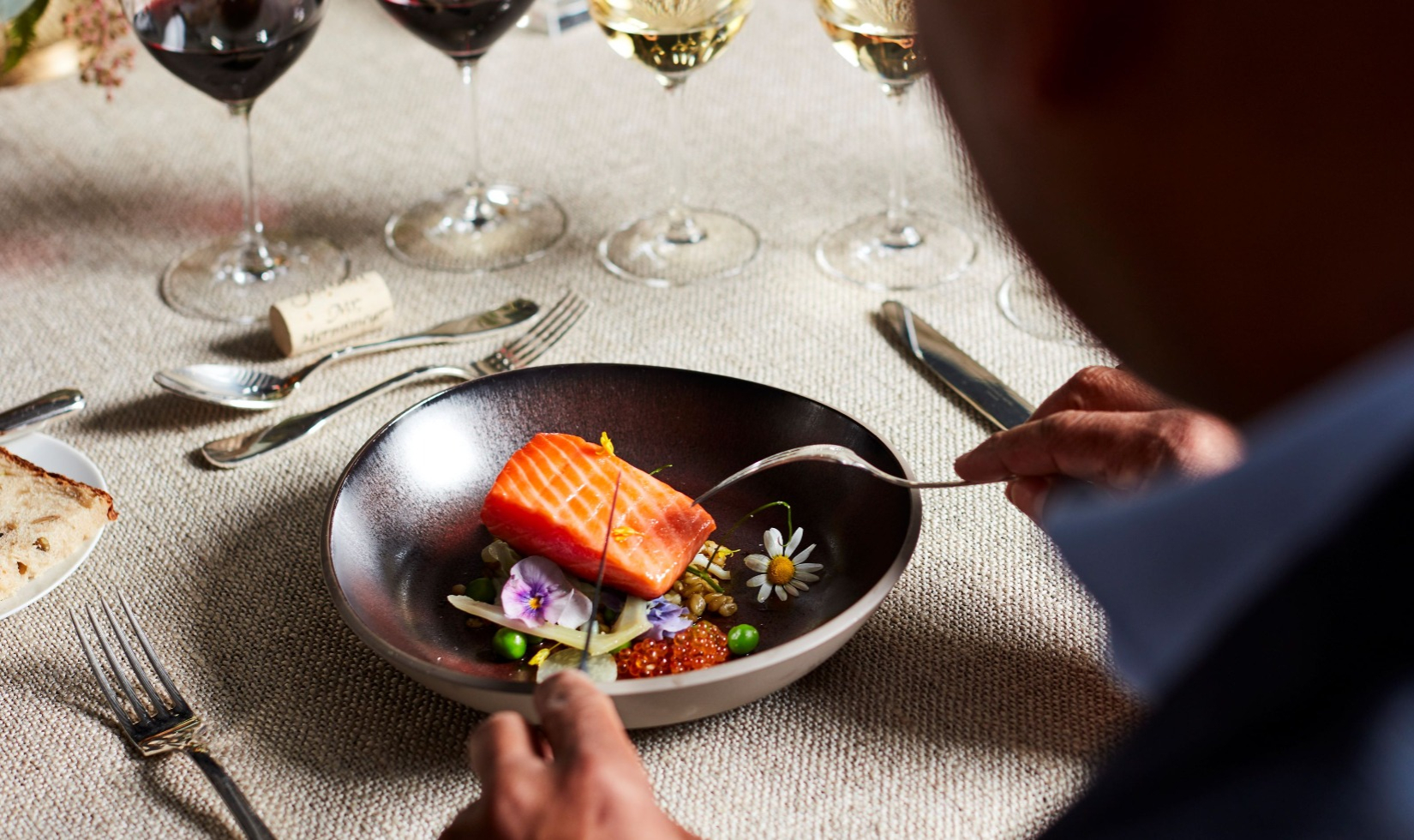 Salmon dish at formal table setting in the Jordan Dining Room