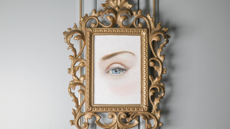 Framed painting of a woman's eyes inspired by Sally Jordan