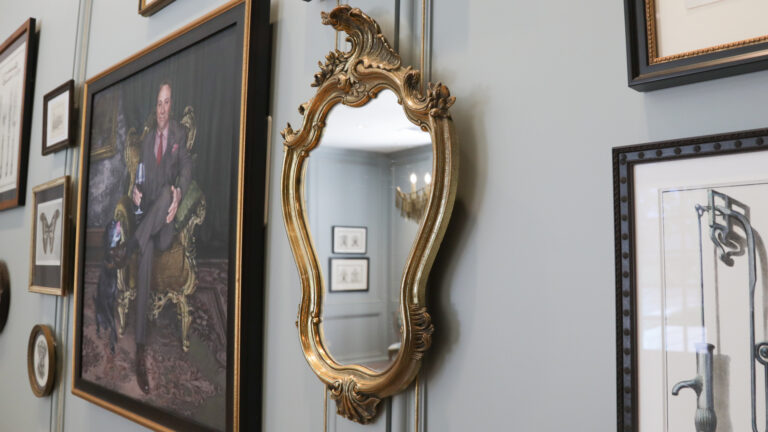 Ornate antique mirror with golden frame