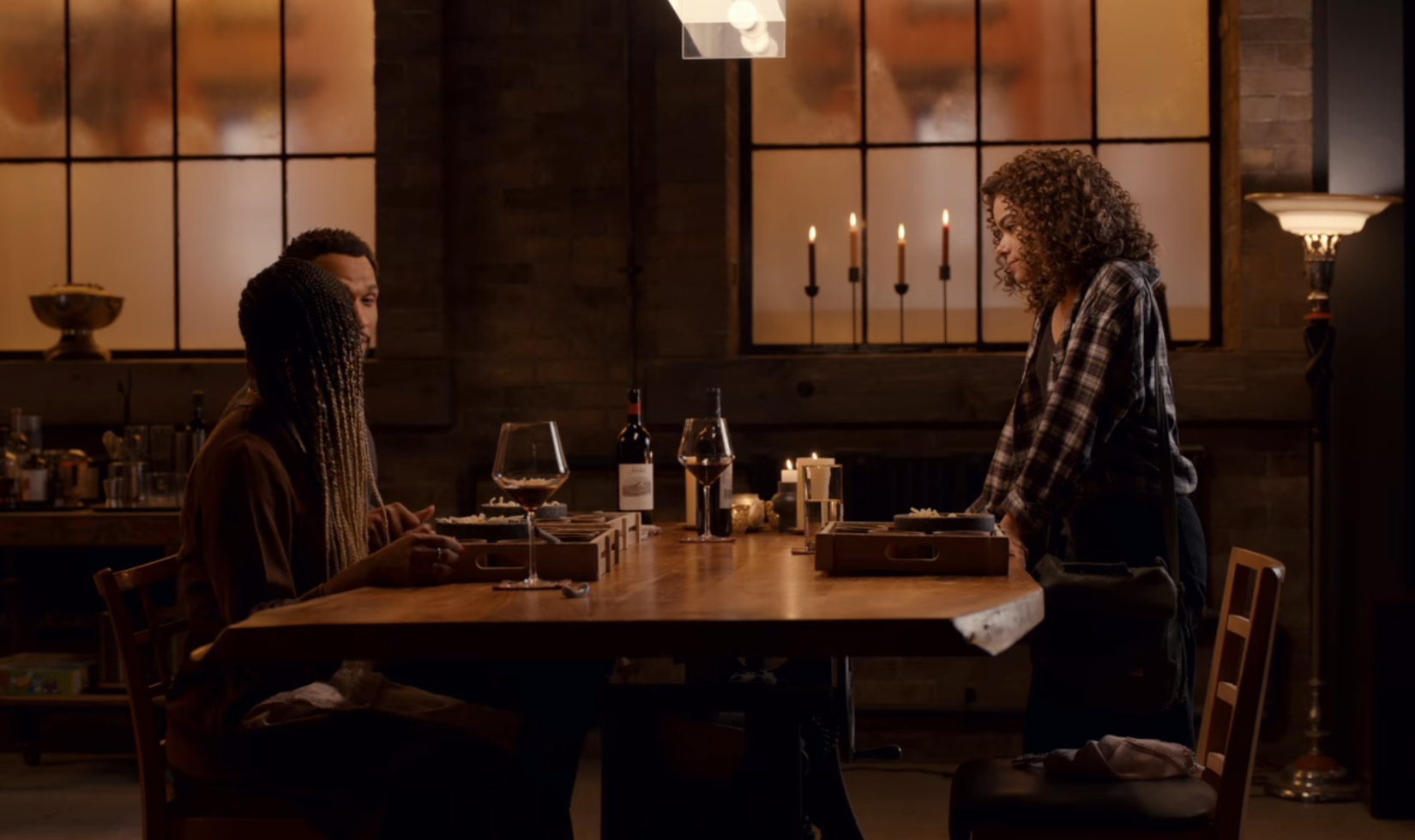 Screenshot from the TV series Ginny & Georgia, showing group dining at a restaurant with a bottle of Jordan Cabernet Sauvignon on the table